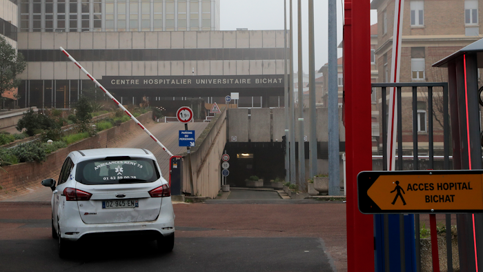 An ambulance drive in to the Bichat hospital in Paris, Saturday Jan. 25, 2020. France has announced three confirmed cases of the deadly new virus from China, the first cases in Europe and the first outside Asia and the United States. One of people who caught the virus is hospitalized in the southwestern city of Bordeaux. The others are in Paris.