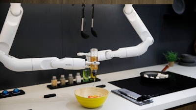 The Bot Chef is on display before a demonstration at the Samsung booth during the CES tech show, Tuesday, Jan. 7, 2020, in Las Vegas. The robot is designed to help with cooking tasks, not to make a meal all on it's own.