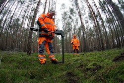 In this Wednesday, Jan. 8, 2020 photo members of a bomb disposal team search for World War II munition at the site of the planned new Tesla Gigafactory in Gruenheide near Berlin, Germany.