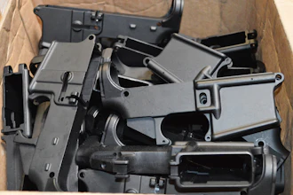 This photo provided by the U.S. Department of Justice shows AR-15 lower receivers, which federal agents have seized, including these unfinished ones taken in 2014 in California, for firearms investigations nationwide. For decades, the federal government has treated the mechanism called the lower receiver as the essential piece of the semiautomatic rifle, which has been used in some of the nation's deadliest mass shootings. But some defense attorneys have recently argued that the part alone does not meet the definition in the law.