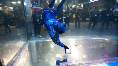 A Sublue diver moves around with the Sublue WhiteShark Mix outfitted with dual propellers for power and balance shown at their water tank booth during the CES tech show Wednesday, Jan. 8, 2020, in Las Vegas.