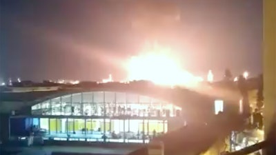 In this image made from video provided by Alejandro Sancho, a fire is seen in Tarragona, Spain, Tuesday, Jan. 14, 2020. A massive explosion took place at an industrial zone for chemicals in northeastern Spain on Tuesday, and the regional emergency services agency warned people nearby not to go outside. A tweet by emergency services for the Catalonia region called the blast in the port city of Tarragona a “chemical accident” and said no information on possible deaths or injuries was available.