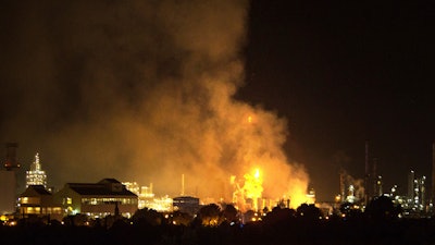 Smoke rise following a big explosion at an industrial hub near the port city of Tarragona, Spain, Tuesday, Jan. 14, 2020. A chemical emergency alert has been activated in northeastern Spain following a big explosion in an industrial zone near the port city of Tarragona, regional emergency services said Tuesday.