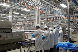 In this Dec. 12, 2019, file photo workers process chickens at the Lincoln Premium Poultry plant, Costco Wholesale's dedicated poultry supplier, in Fremont, Neb. On Friday, Jan. 17, 2020, the Federal Reserve reports on U.S. industrial production for December.