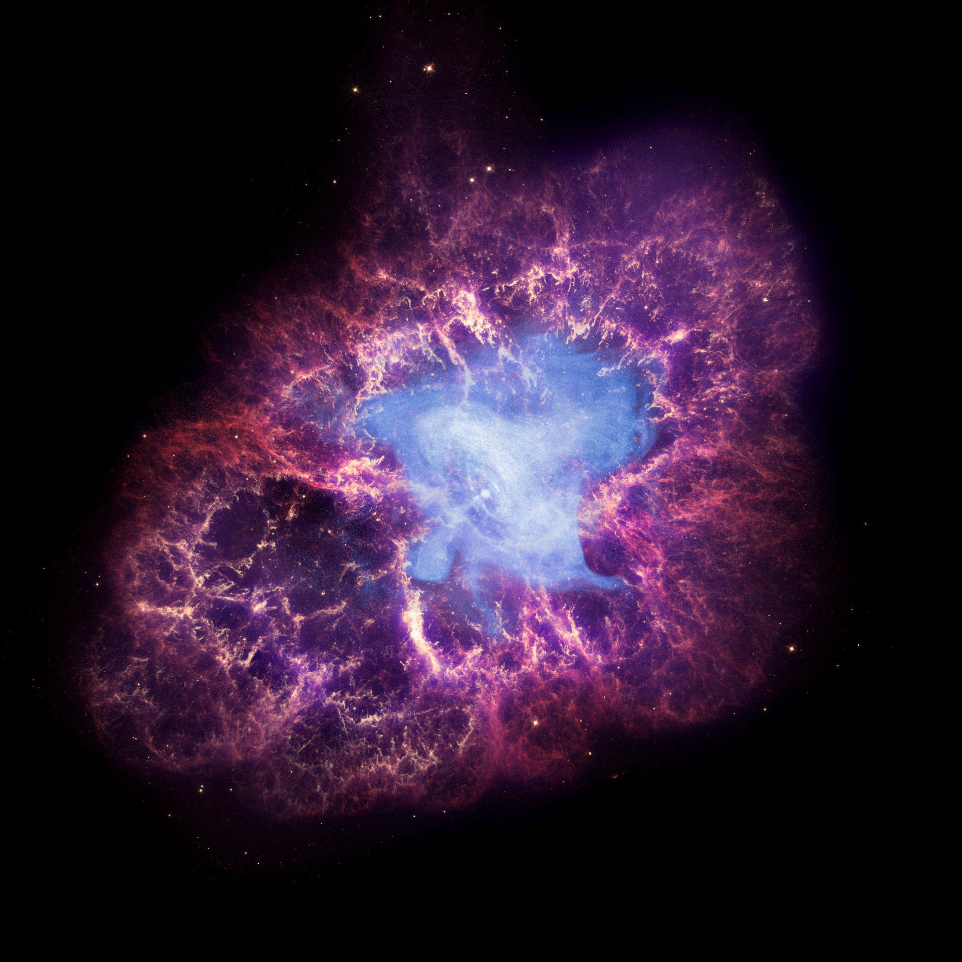 This composite image made available by NASA shows a neutron star, center, left behind by the explosion from the original star's death in the constellation Taurus, observed on Earth as the supernova of A.D. 1054. This image uses data from three of NASA's observatories: the Chandra X-ray image is shown in blue, the Hubble Space Telescope optical image is in red and yellow, and the Spitzer Space Telescope's infrared image is in purple. After nearly two decades in Earth orbit, scanning the universe with infrared eyes, ground controllers plan to put the faltering Spitzer Space Telescope into permanent hibernation on Thursday, Jan. 29, 2020.