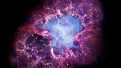 This composite image made available by NASA shows a neutron star, center, left behind by the explosion from the original star's death in the constellation Taurus, observed on Earth as the supernova of A.D. 1054. This image uses data from three of NASA's observatories: the Chandra X-ray image is shown in blue, the Hubble Space Telescope optical image is in red and yellow, and the Spitzer Space Telescope's infrared image is in purple. After nearly two decades in Earth orbit, scanning the universe with infrared eyes, ground controllers plan to put the faltering Spitzer Space Telescope into permanent hibernation on Thursday, Jan. 29, 2020.