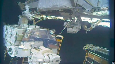 In this image take from NASA video, astronauts Jessica Meir, right, and Christina Koch install batteries for the International Space Station's solar power grid during a space walk Monday, Jan. 20, 2020.