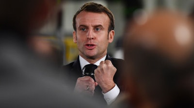 French President Emmanuel Macron delivers a speech as he visits a plant of British-Swedish pharmaceutical group Astrazeneca in Dunkirk, northern France, Monday, Monday, Jan. 20, 2020. French President Emmanuel Macron is hosting 180 international business leaders at the Palace of Versailles in a bid to promote France's economic attractiveness despite over six weeks of crippling strikes over his government's planned pension changes.
