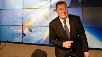 In this Jan. 19, 2020, file photo Elon Musk, founder, CEO, and chief engineer/designer of SpaceX speaks during a news conference at the Kennedy Space Center in Cape Canaveral, Fla. The meteoric rise of Tesla shares that pushed the company's value over $100 billion could turn into a supercharged payday for CEO Elon Musk.