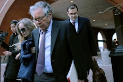 Insys Therapeutics founder John Kapoor, front, departs federal court Thursday, Jan. 23, 2020, in Boston, after he was sentenced to 5 1/2 years in prison for orchestrating a bribery and kickback scheme prosecutors said helped fuel the opioid crisis. He was found guilty the previous May of racketeering and conspiracy in a scheme where millions of dollars in bribes were paid to doctors across the United States to prescribe the company's highly addictive oral fentanyl spray, known as Subsys.