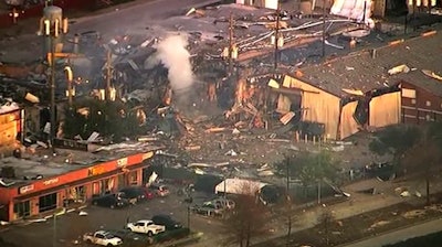 This aerial photo taken from video provided by KTRK-TV shows damage to buildings after an explosion in Houston on Friday, Jan. 24, 2020. A large explosion left rubble scattered in the area, damaged nearby homes and was felt for miles away. A fire continues to burn and people have been told to avoid the area.