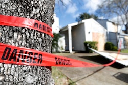 Red 'danger' tape circles a damaged home on Bridgeland Lane in Houston, Sunday, Jan. 26, 2020, after the Watson Grinding Manufacturing explosion early Friday morning.