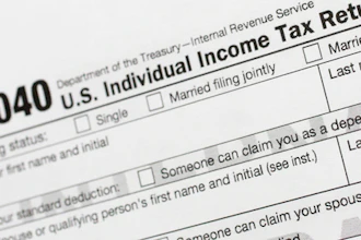 This July 24, 2018, file photo shows a portion of the 1040 U.S. Individual Income Tax Return form.