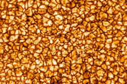 This undated photo provided by the National Science Foundation in January 2020 shows on of the Daniel K. Inouye Solar Telescope's first images of the sun, revealing its turbulent gas surface in what scientists called unprecedented detail. Prof. Jeffrey Kuhn of the University of Hawaii, Manoa says this image is about 10,000 kilometers (6,200 miles) on a side, and that the 'bubbles' on the surface are about the size of Texas.