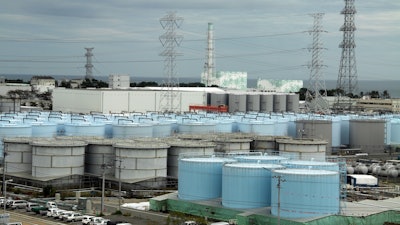 In this Oct. 12, 2017, file photo, ever-growing amount of contaminated, treated but still slightly radioactive, water at the wrecked Fukushima Dai-ichi nuclear plant is stored in about 900 huge tanks.