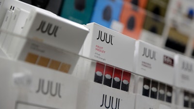 This file photo shows Juul products displayed at a smoke shop in New York.