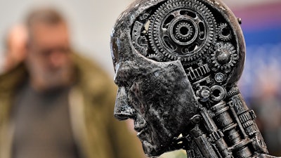 In this Nov. 29, 2019, file photo, a metal head made of motor parts symbolizes artificial intelligence, or AI, at the Essen Motor Show for tuning and motorsports in Essen, Germany. The Trump administration is proposing new rules guiding how the U.S. government regulates the use of artificial intelligence in medicine, transportation and other industries. The White House unveiled the proposals Tuesday, Jan. 7, and said they're meant to promote private sector applications of AI that are safe and fair.