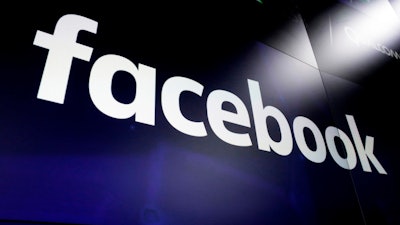 This March 29, 2018 file photo, shows the logo for social media giant Facebook at the Nasdaq MarketSite in New York's Times Square. Facebook said Monday Jan. 6, 2020 that it is banning “deepfake” videos, the false but realistic clips created with artificial intelligence and sophisticated tools, as it steps up efforts to fight online manipulation.