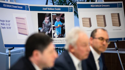 Placards showing images of Jozef Dudek and IKEA's Malm dressers are displayed during a news conference in Philadelphia, Monday, Jan. 6, 2020. IKEA has agreed to pay $46 million to the parents of a 2-year-old boy who died of injuries suffered when a 70-pound recalled dresser tipped over onto him, the family’s lawyers said Monday.