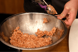 J. Michael Melton, head of culinary for Impossible Foods, the California plant-based meat company, prepares some Impossible Pork dishes as the company unveils Impossible Pork and Impossible Sausage before the CES tech show Monday, Jan. 6, 2020, in Las Vegas.