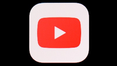 This March 20, 2018, file photo shows the YouTube app on an iPad. YouTube's trust and safety team is tasked with deciding what the video site allows to reach its enormous audience, and what gets taken down. Team leader Matt Halprin constantly has to balance safety and civility with what the company considers a core mission: freedom of expression.