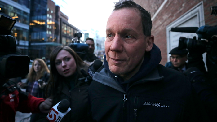 Harvard University professor Charles Lieber is surrounded by reporters as he leaves the Moakley Federal Courthouse in Boston, Thursday, Jan. 30, 2020. Leiber, chair of the department of chemistry and chemical biology, with lying to officials about his involvement with a Chinese government-run recruitment program through which he received tens of thousands of dollars.