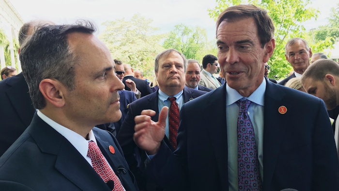 In this April 26, 2107 file photo, Braidy Industries Inc. CEO Craig Bouchard, right, and Republican Gov. Matt Bevin speak with reporters in Wurtland, Ky. Braidy Industries said Thursday, Jan. 30, 2020, that its chairman and CEO, Craig Bouchard, would step down from that role but would remain a member of the company's board of directors. The company offered no reason for the change, which comes at a crucial time for efforts to build the mill near Ashland.