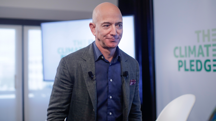 In this Thursday, Sept. 19, 2019 file photo, Amazon CEO Jeff Bezos walks off stage after holding a news conference at the National Press Club in Washington to announce the Climate Pledge, setting a goal to meet the Paris Agreement 10 years early. On Monday, Feb. 17, 2020, Bezos said that he plans to spend $10 billion of his own fortune to help fight climate change.
