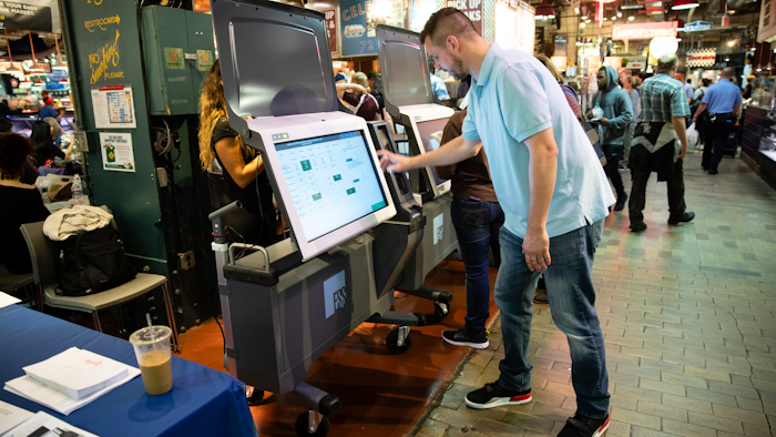 In this June 13, 2019, file photo, Steve Marcinkus, an Investigator with the Office of the City Commissioners, demonstrates the ExpressVote XL voting machine at the Reading Terminal Market in Philadelphia.