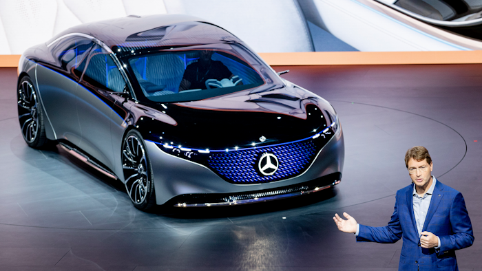 In this file photo Ola Kaellenius, CEO of Mercedes, stands next to a 'Vision EQS' car at the IAA Auto Show in Frankfurt, Germany.