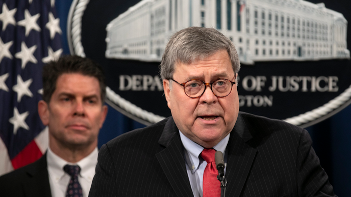 Attorney General William Barr, right, next to FBI Deputy Director David Bowdich, speaks during a news conference at the Justice Department in Washington.