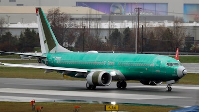 In this Dec. 11, 2019, file photo, a Boeing 737 Max being built for Norwegian Air International taxis for a test flight, at Renton Municipal Airport in Renton, Wash. Boeing has found a new problem with changes it is making to software on the 737 Max, but the company says the issue will not further delay the grounded plane’s return to flight. The head of the Federal Aviation Administration, Stephen Dickson, discussed the issue Thursday, Feb. 6, 2020 with reporters in London.