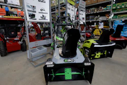 In this Jan. 27, 2020 photo snow blowers are lined up at a Home Depot store location in Boston.