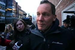 Harvard University professor Charles Lieber is surrounded by reporters as he leaves the Moakley Federal Courthouse in Boston, Thursday, Jan. 30, 2020. Leiber, chair of the department of chemistry and chemical biology, with lying to officials about his involvement with a Chinese government-run recruitment program through which he received tens of thousands of dollars.