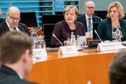German Chancellor Angela Merkel, center, speaks alongside Peter Altmaier, Federal Minister of Economics and Energy, left, and Julia Klöckner, Federal Minister of Food and Agriculture, at the beginning of a meeting of the Federal Government with representatives of the food industry in Berlin, Germany, Monday, Feb.3, 2020.