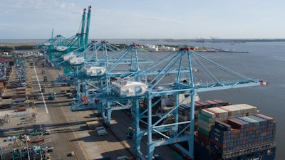 In this Friday, May 10, 2019 file photo, a container ship is unloaded at the Virginia International Gateway terminal in Norfolk, Va.