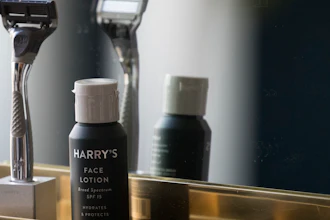 In this June 15, 2018, file photo, the Winston razor and Harry's face lotion are on display at the headquarters of Harry's Inc., in New York. Federal antitrust regulators say a proposed merger that would combine old-school shaving company Schick with upstart Harry's would end up costing consumers some skin.