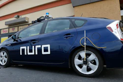 In this Aug. 16, 2018 file photo, a self-driving Nuro vehicle parks outside a Fry's supermarket in Scottsdale, Ariz.