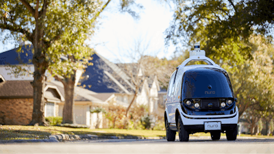 This undated image provided by Nuro in February 2020 shows their self-driving vehicle 'R2' on a neighborhood street. On Thursday, Feb. 6, 2020, the U.S. National Highway Traffic Safety Administration granted temporary approval for Silicon Valley robotics company Nuro to the a low-speed autonomous delivery vehicle, without side and rear-view mirrors and other safety provisions required of vehicles driven by humans.