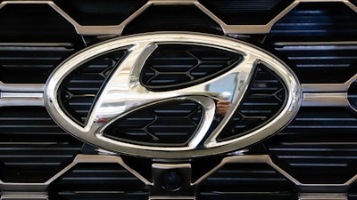 This Feb. 14, 2019 file photo shows the Hyundai logo on a 2019 Hyundai Santa Fe SUV on display at the 2019 Pittsburgh International Auto Show in Pittsburgh.