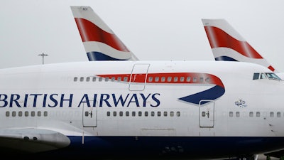 In this Tuesday, Jan. 10, 2017, file photo, British Airways planes are parked at Heathrow Airport in London.