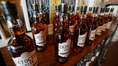 In this June 20, 2018 file photo, Catoctin Creek Distillery whiskey is on display in a tasting room in Purcellville, Va.
