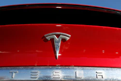 In this Feb. 2, 2020 file photograph, the company logo sits on an unsold 2020 Model X at a Tesla dealership in Littleton, Colo.