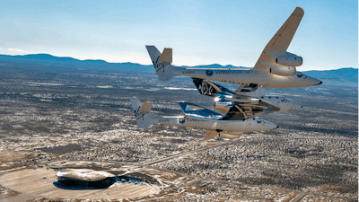 This photo provided by Virgin Galactic shows the Virgin Galactic's VSS Unity flying over Spaceport America in Truth or Consequences, NM on Thursday, Feb. 13, 2020.