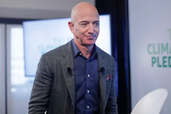 In this Thursday, Sept. 19, 2019 file photo, Amazon CEO Jeff Bezos walks off stage after holding a news conference at the National Press Club in Washington to announce the Climate Pledge, setting a goal to meet the Paris Agreement 10 years early. On Monday, Feb. 17, 2020, Bezos said that he plans to spend $10 billion of his own fortune to help fight climate change.