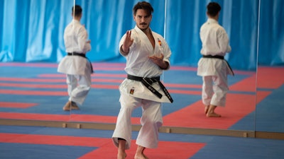 Spanish karate athlete Damian Quinteros, centre, trains in Madrid, Spain, Friday, Feb. 7, 2020. More than five years ago, one of Spain's most successful karate athletes was splitting his time between practice, school and his day job as an aeronautical engineer. Now, nearly five months before the Tokyo Games, Quintero is a full-time karateka and a top contender for the gold medal in Japan.
