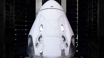 This undated photo made available by SpaceX in February 2020 shows the Crew Dragon spacecraft undergoing acoustic testing in Florida. On Tuesday, Feb. 18, 2020, SpaceX announced it is working with Space Adventures Inc. to take tourists into a high orbit. Ticket prices aren't being divulged but are likely to be in the millions of dollars.