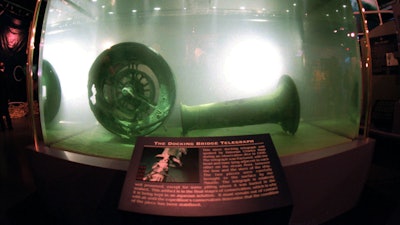 In this Nov. 26, 1996 file photo, the docking bridge telegraph recovered from the wreckage of the Titanic is displayed in a large seawater-filled tank at the Nauticus National Maritime Center in Norfolk, Va. The salvage firm that has plucked artifacts from the sunken Titanic cruise ship over the decades is seeking a judge's permission to rescue more items from the rapidly deteriorating wreck.