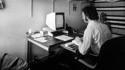 In this 1970s photo provided by Xerox PARC, Larry Tesler uses the Xerox Parc Alto early personal computer system. Tesler, the Silicon Valley pioneer who created the now-ubiquitous computer concepts such as “cut,” “copy” and “paste,” has died. He was 74.