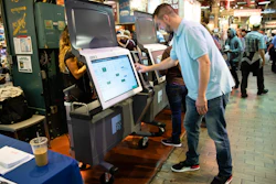 In this June 13, 2019, file photo, Steve Marcinkus, an Investigator with the Office of the City Commissioners, demonstrates the ExpressVote XL voting machine at the Reading Terminal Market in Philadelphia.